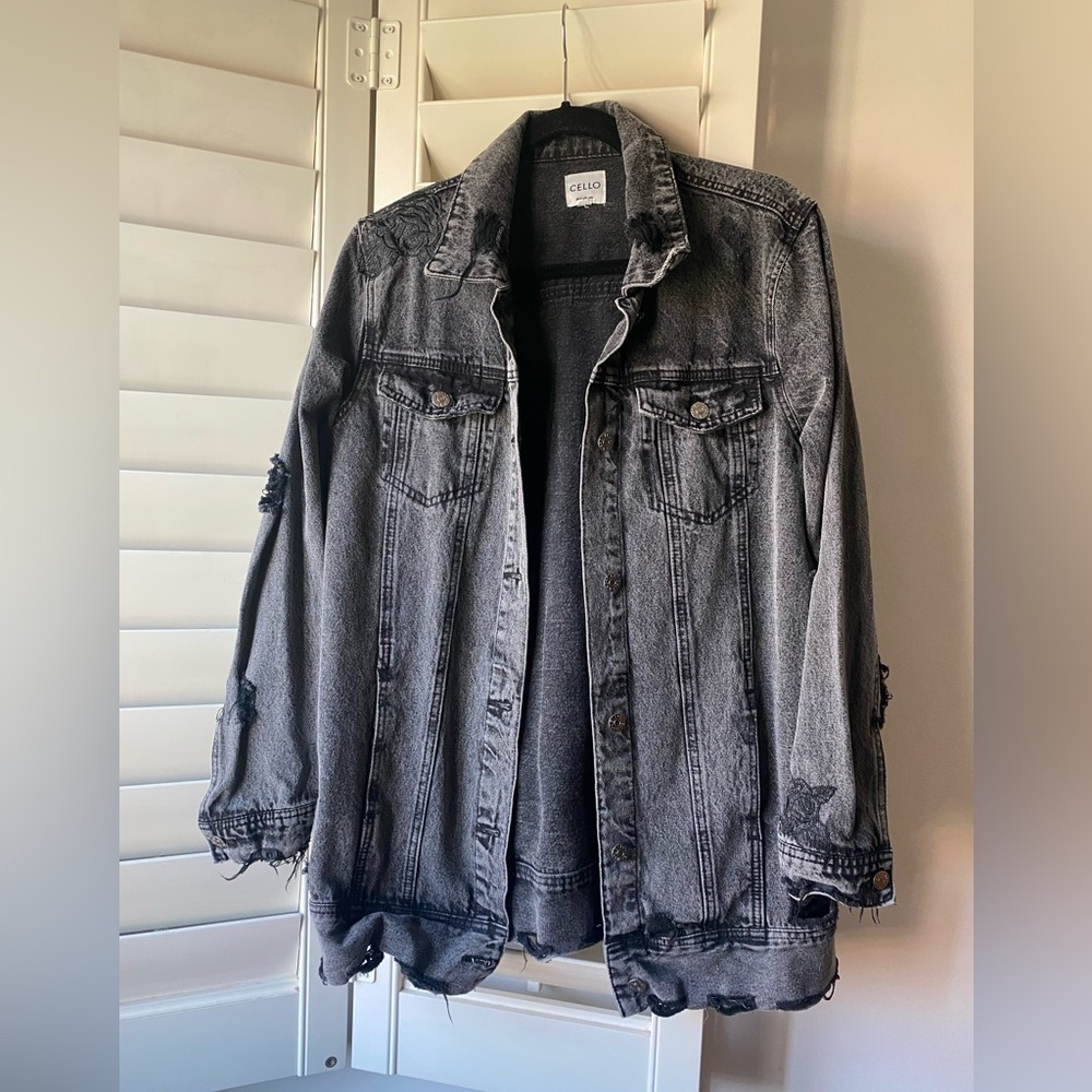 Black, acid wash, denim jacket. “Worn” look w/ rips & rose embroidery.